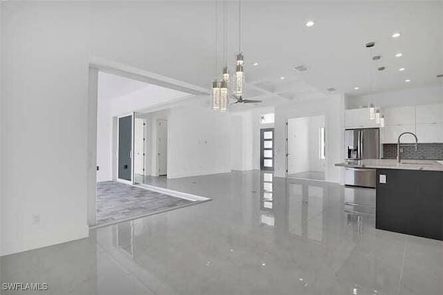 interior space featuring sink and ceiling fan