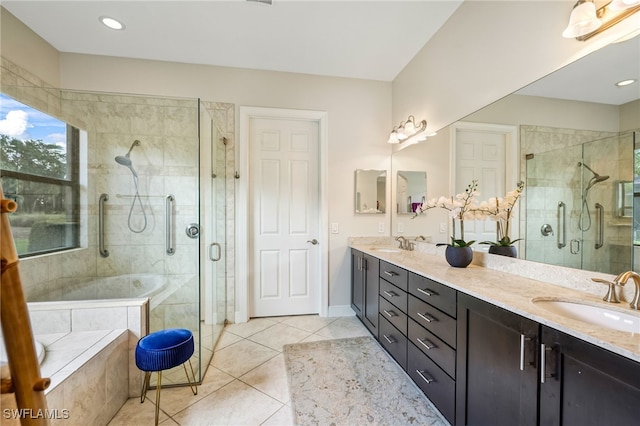 bathroom featuring vanity, tile patterned floors, and independent shower and bath