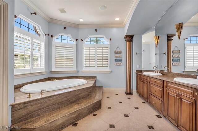 bathroom with vanity, crown molding, and tiled bath