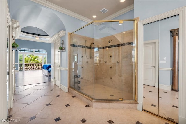 bathroom featuring ceiling fan, ornamental molding, a shower with shower door, and tile patterned flooring