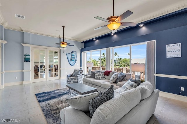 living room featuring light tile patterned floors, french doors, and ceiling fan