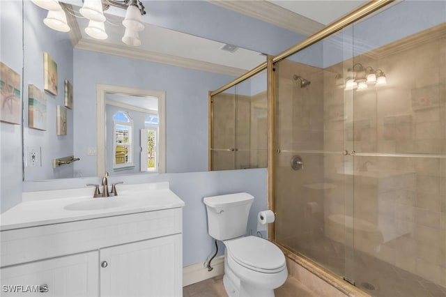 bathroom featuring crown molding, vanity, a notable chandelier, a shower with shower door, and toilet