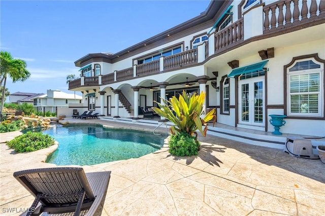 view of pool featuring a patio and french doors