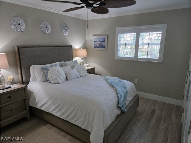 bedroom featuring dark hardwood / wood-style flooring, ornamental molding, and ceiling fan