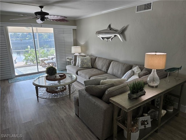 living room featuring hardwood / wood-style flooring, ornamental molding, and ceiling fan