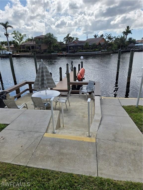 dock area featuring a water view