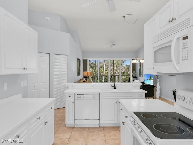 kitchen featuring sink, white appliances, white cabinetry, ceiling fan with notable chandelier, and decorative light fixtures