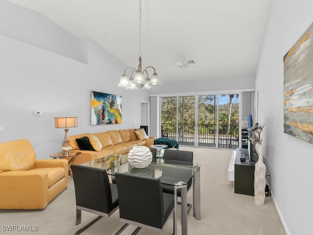 dining space with vaulted ceiling, light colored carpet, and an inviting chandelier