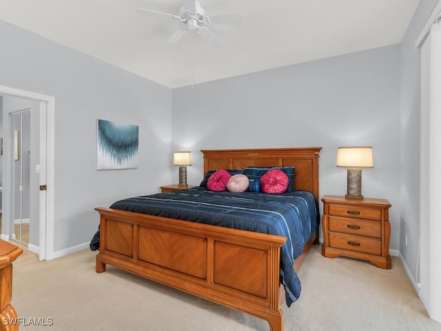 bedroom featuring light colored carpet and ceiling fan