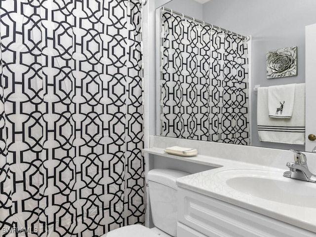 bathroom with vanity and toilet