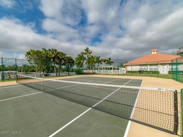 view of tennis court featuring basketball court