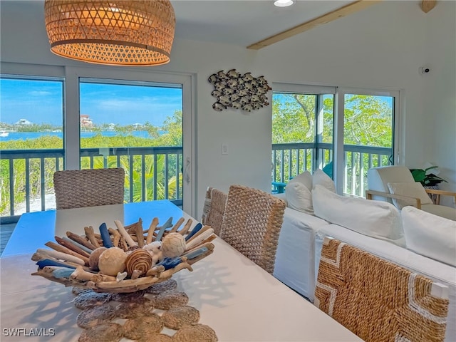 dining space with vaulted ceiling