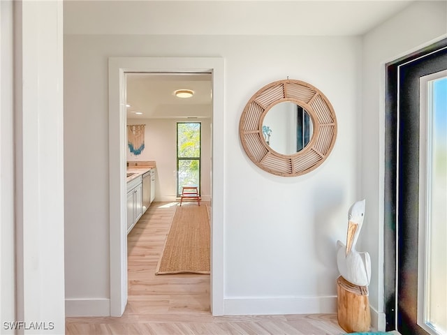 hallway featuring light wood-type flooring