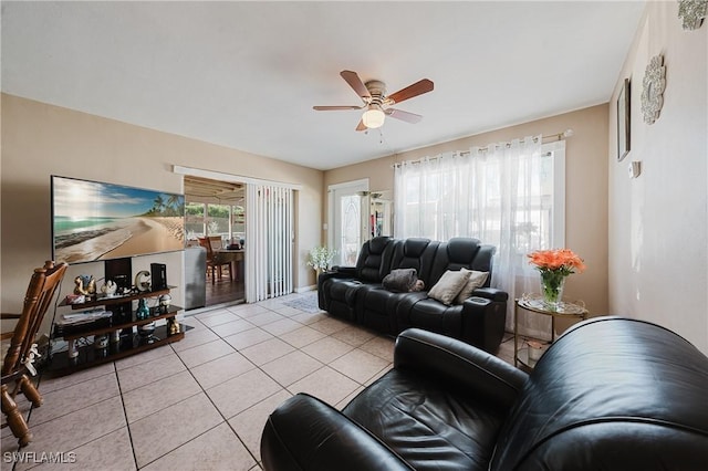 living room with light tile patterned flooring and ceiling fan