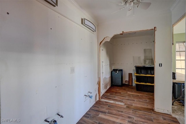 hall featuring hardwood / wood-style flooring and crown molding