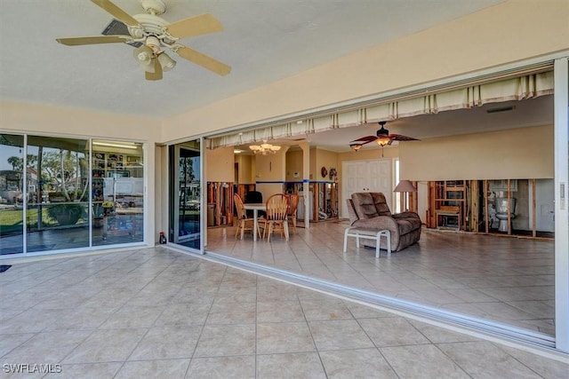 view of patio / terrace featuring ceiling fan