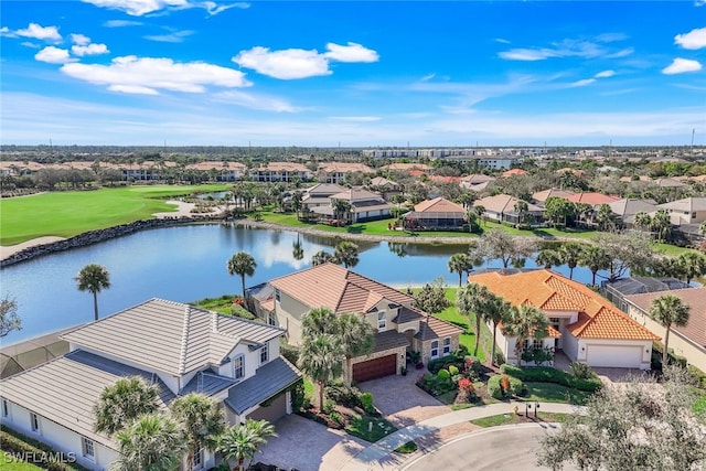 aerial view featuring a water view, a residential view, and view of golf course