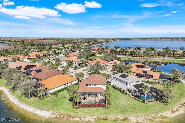bird's eye view with a water view and a residential view