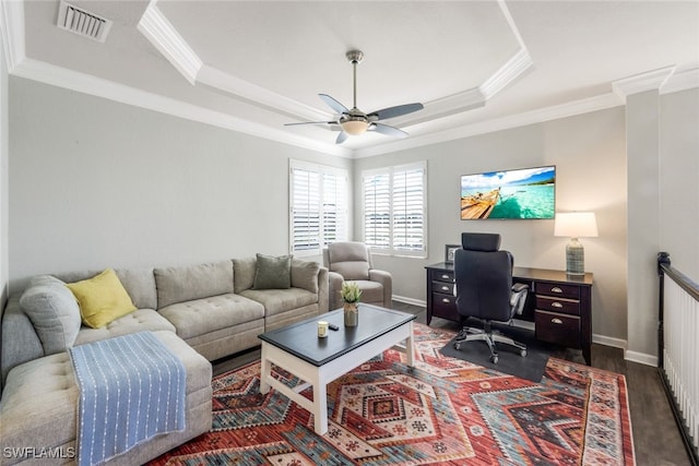 office with a tray ceiling, crown molding, a ceiling fan, and visible vents