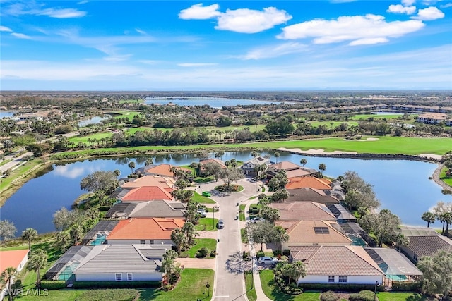 aerial view featuring a water view, golf course view, and a residential view