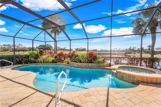 view of pool featuring a patio, a pool with connected hot tub, and glass enclosure