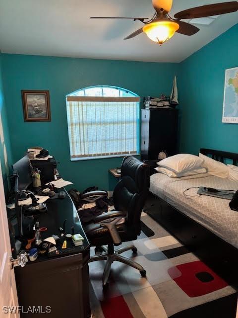 bedroom featuring lofted ceiling and ceiling fan