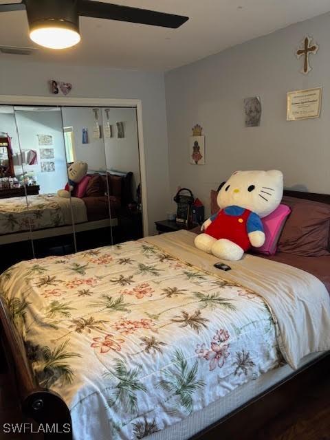 bedroom with vaulted ceiling, a closet, and ceiling fan