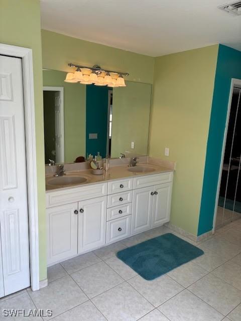 bathroom featuring vanity and tile patterned flooring