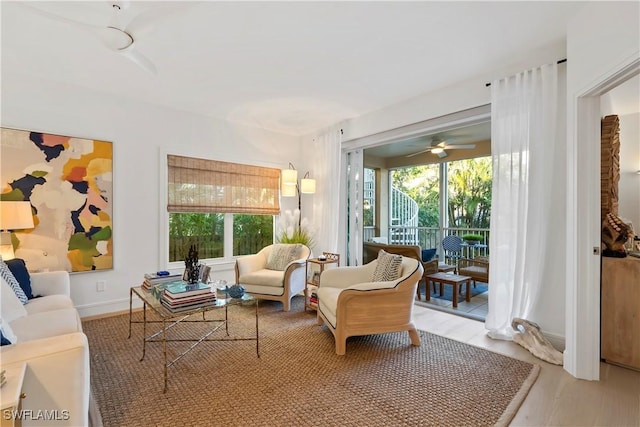 living area featuring plenty of natural light and light hardwood / wood-style floors