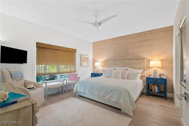 bedroom featuring light hardwood / wood-style floors and ceiling fan