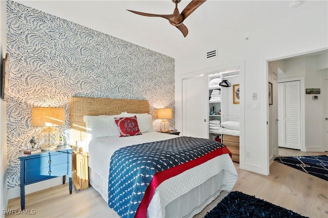 bedroom with wood-type flooring and ceiling fan