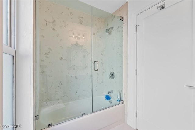 bathroom featuring shower / bath combination with glass door