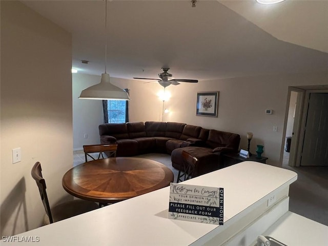 living area with ceiling fan