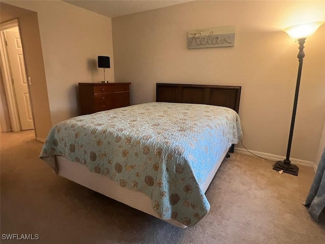 carpeted bedroom with baseboards