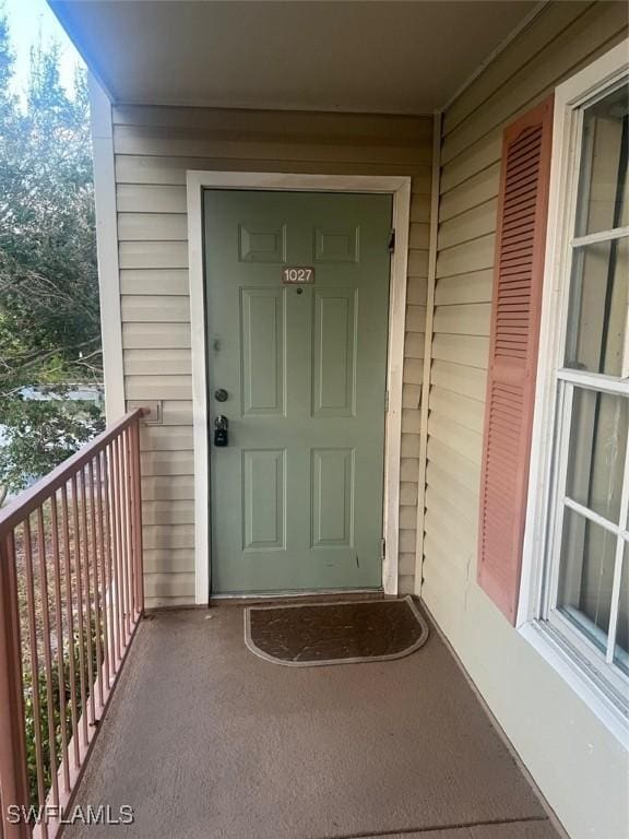 doorway to property featuring a balcony