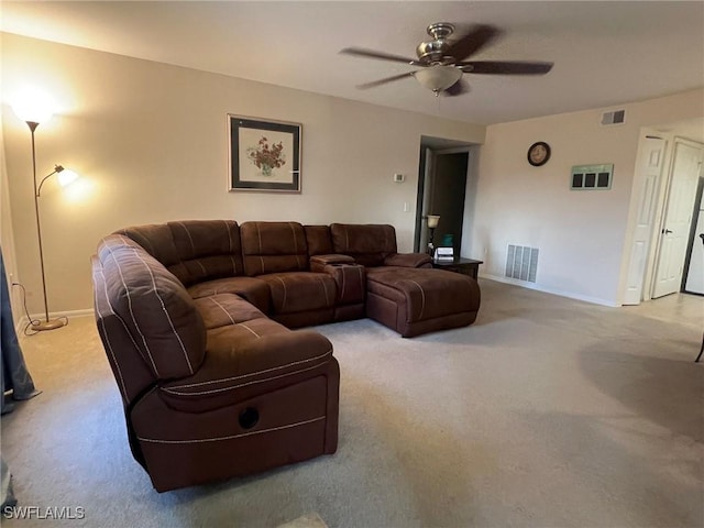 living room featuring light carpet, baseboards, visible vents, and a ceiling fan