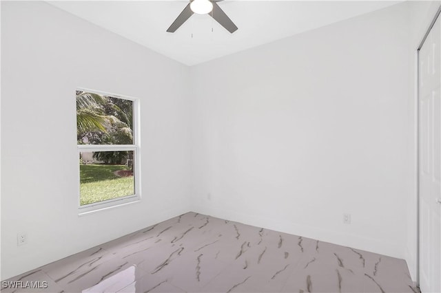 unfurnished room with ceiling fan