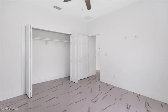 unfurnished bedroom with ceiling fan and a closet