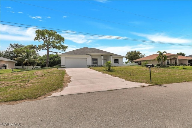 ranch-style home featuring a garage and a front lawn