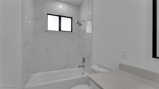 full bathroom featuring vanity, toilet, and tiled shower / bath