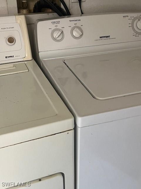 washroom featuring washer and clothes dryer and laundry area