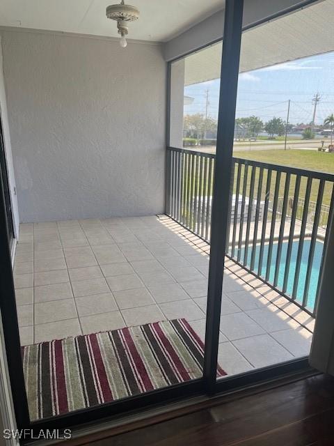 balcony featuring ceiling fan