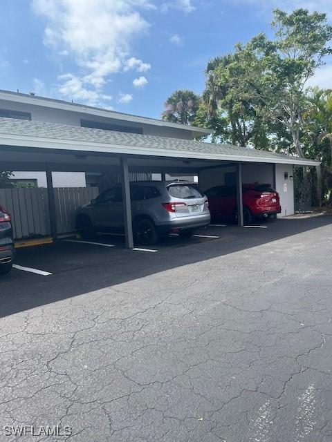 covered parking lot with fence