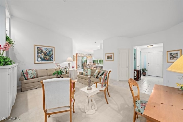 living room with light carpet and light tile patterned flooring