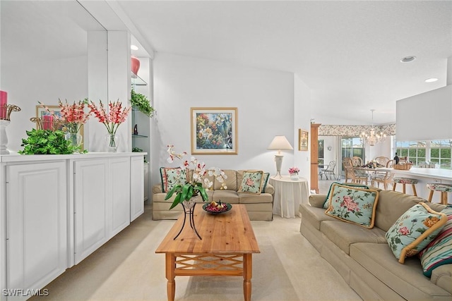 living area featuring recessed lighting, light carpet, and a notable chandelier