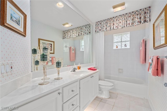 bathroom with vanity, tile patterned floors, toilet, and wallpapered walls