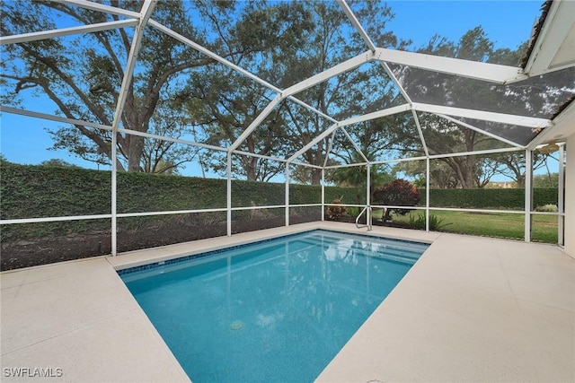 view of pool with a lanai, a patio area, and a fenced in pool