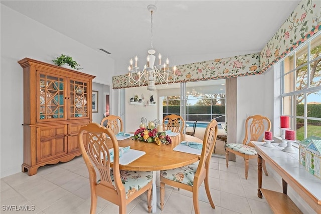 dining room with a chandelier, visible vents, and light tile patterned flooring