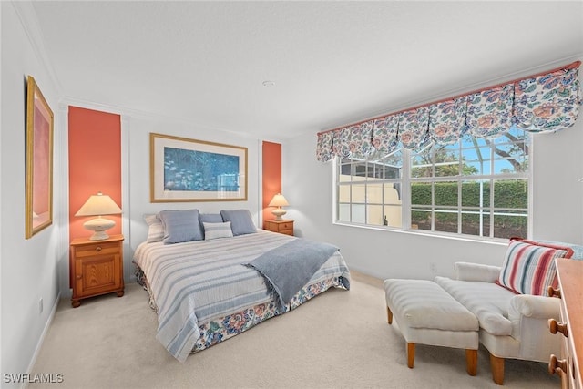 carpeted bedroom featuring ornamental molding