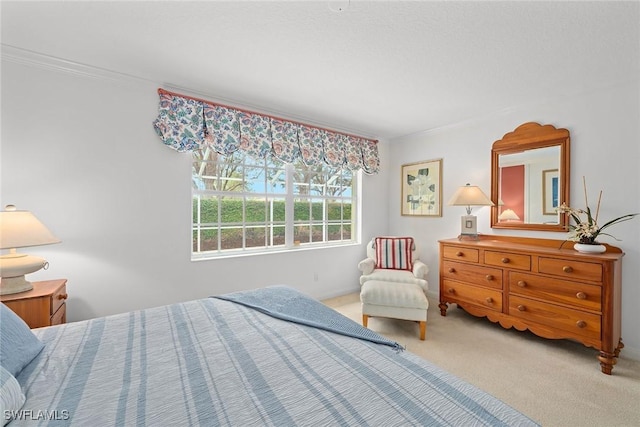 bedroom with carpet floors and ornamental molding